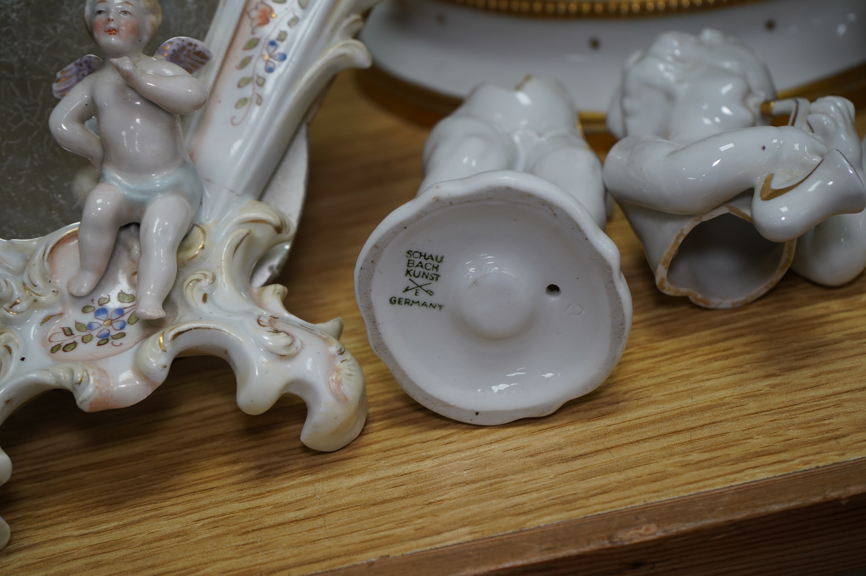 A collection of Continental porcelain ceramic figurines, including a pair of lace examples, dancing ladies and an easel mirror, largest 29cm high. Condition - mostly poor